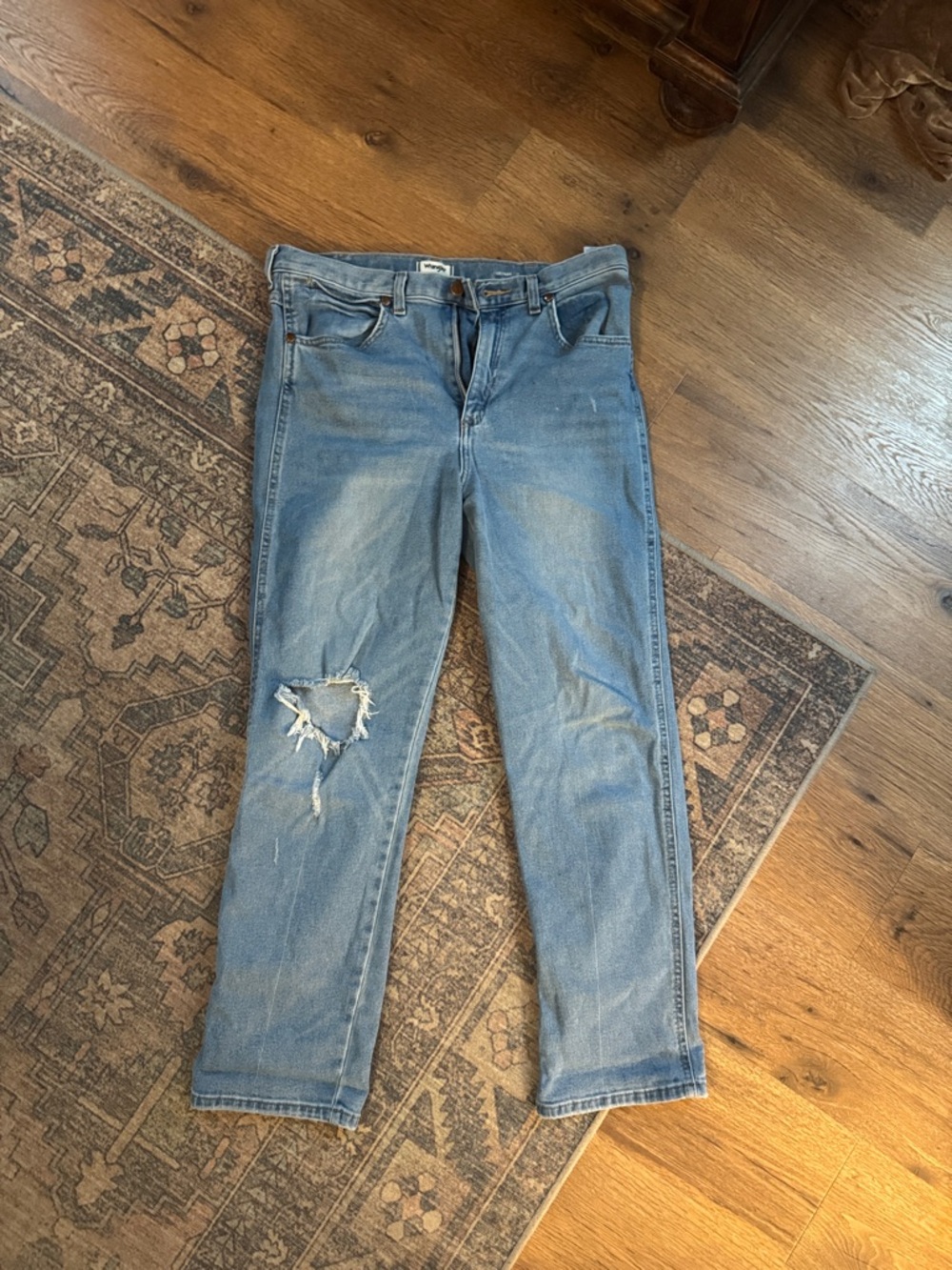 Wrangler Heritage Fit Light Blue Straight-Leg Jeans with Distressed Knee